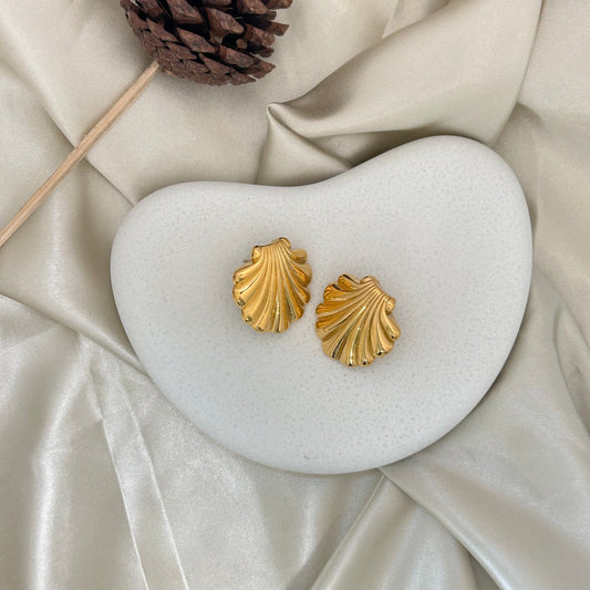 Gold scallop-shell stud earrings with ribbed fan ridges