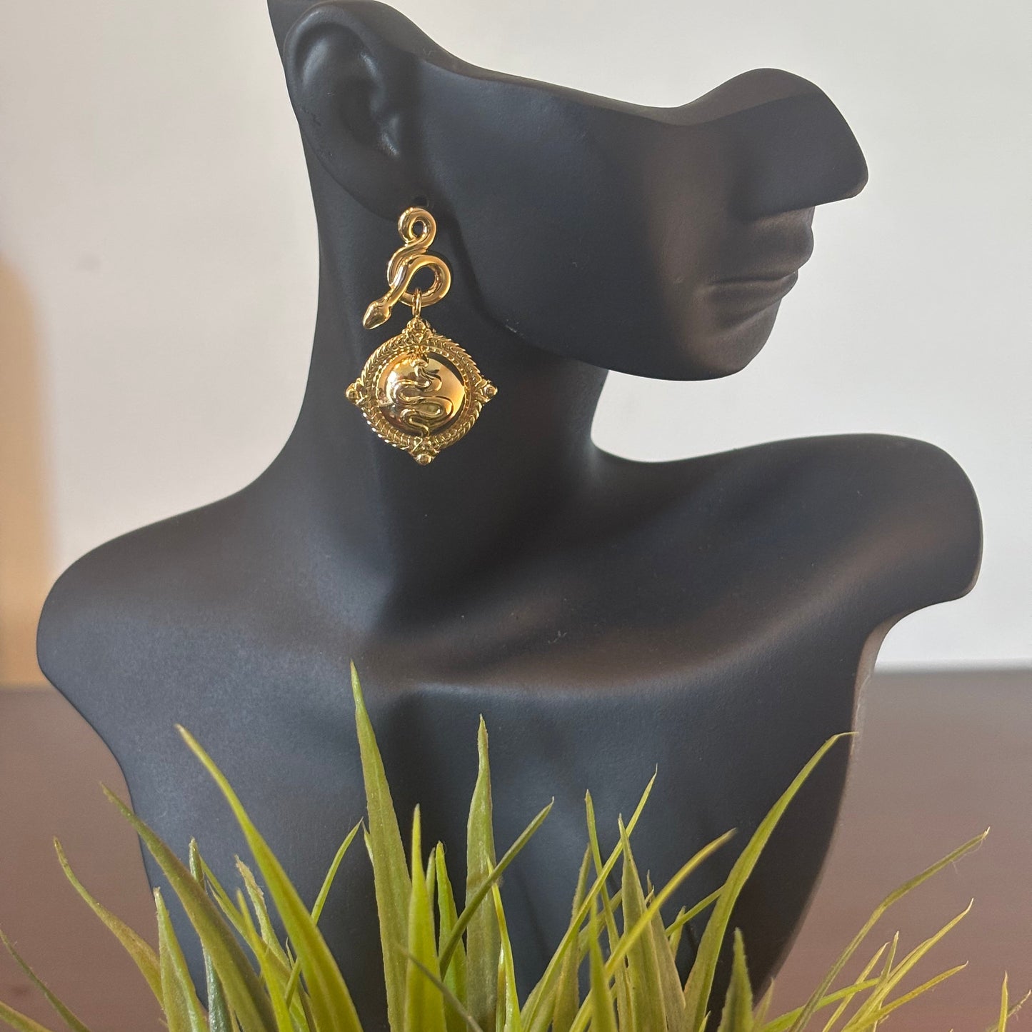 Gold-tone square drop earrings with engraved swirl face and ornate top loop