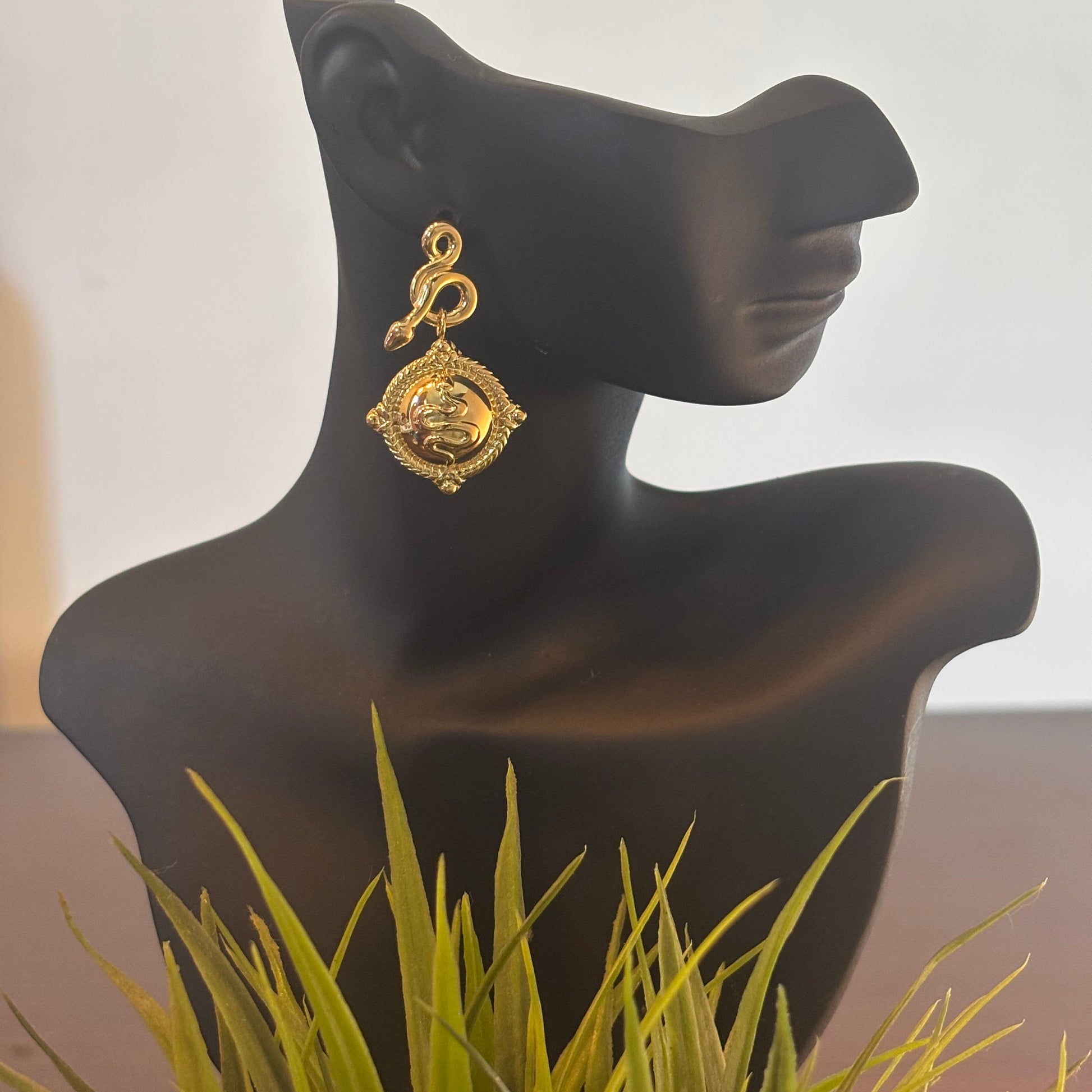 Gold-tone square drop earrings with engraved swirl face and dangling hook