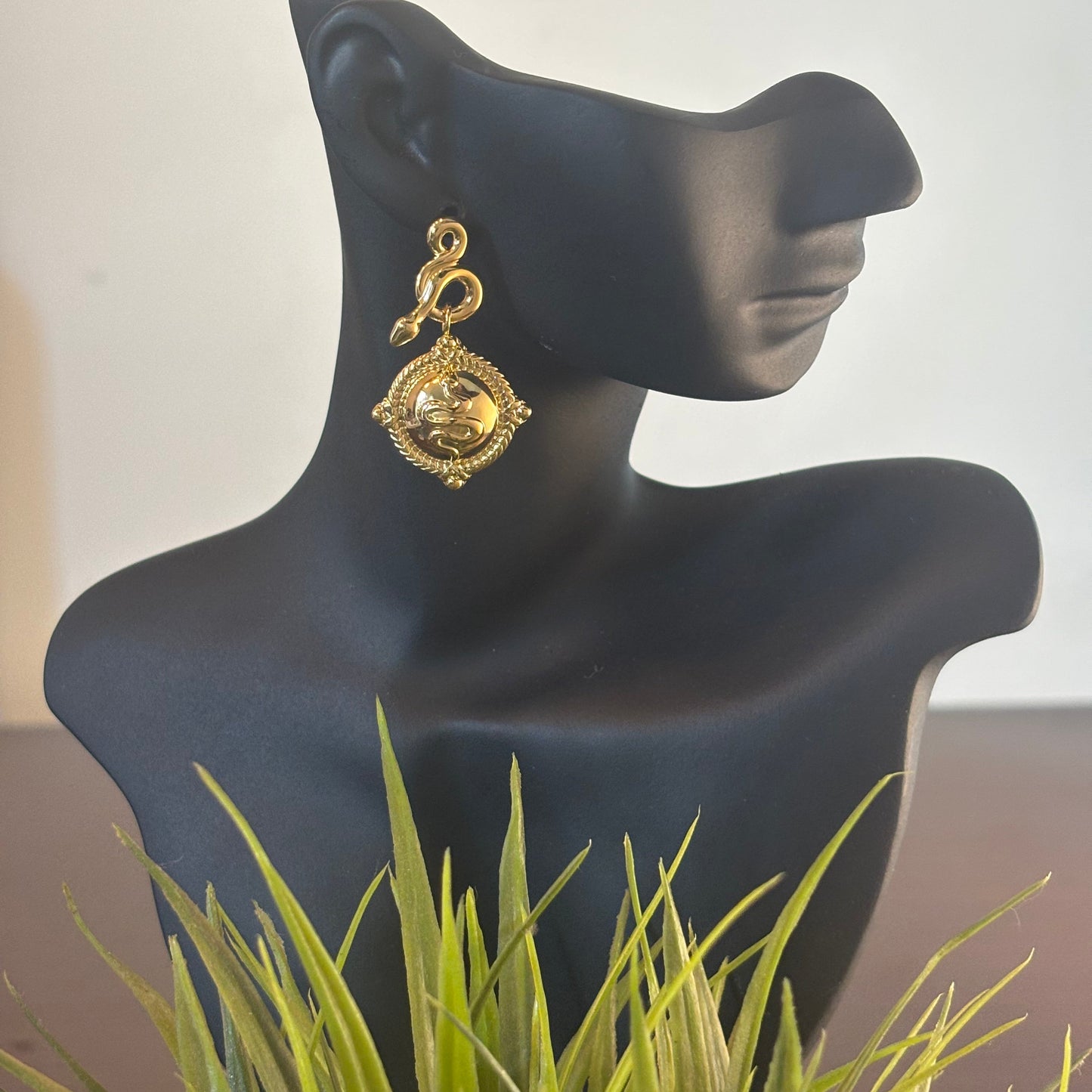 Gold-tone square drop earrings with ornate border and engraved swirl motif