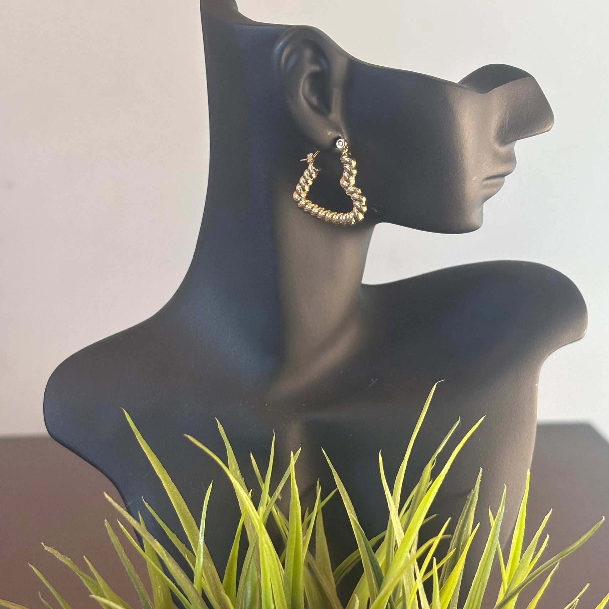 Heart wrap hoop earrings, gold-tone heart-shaped hoops on mannequin ear