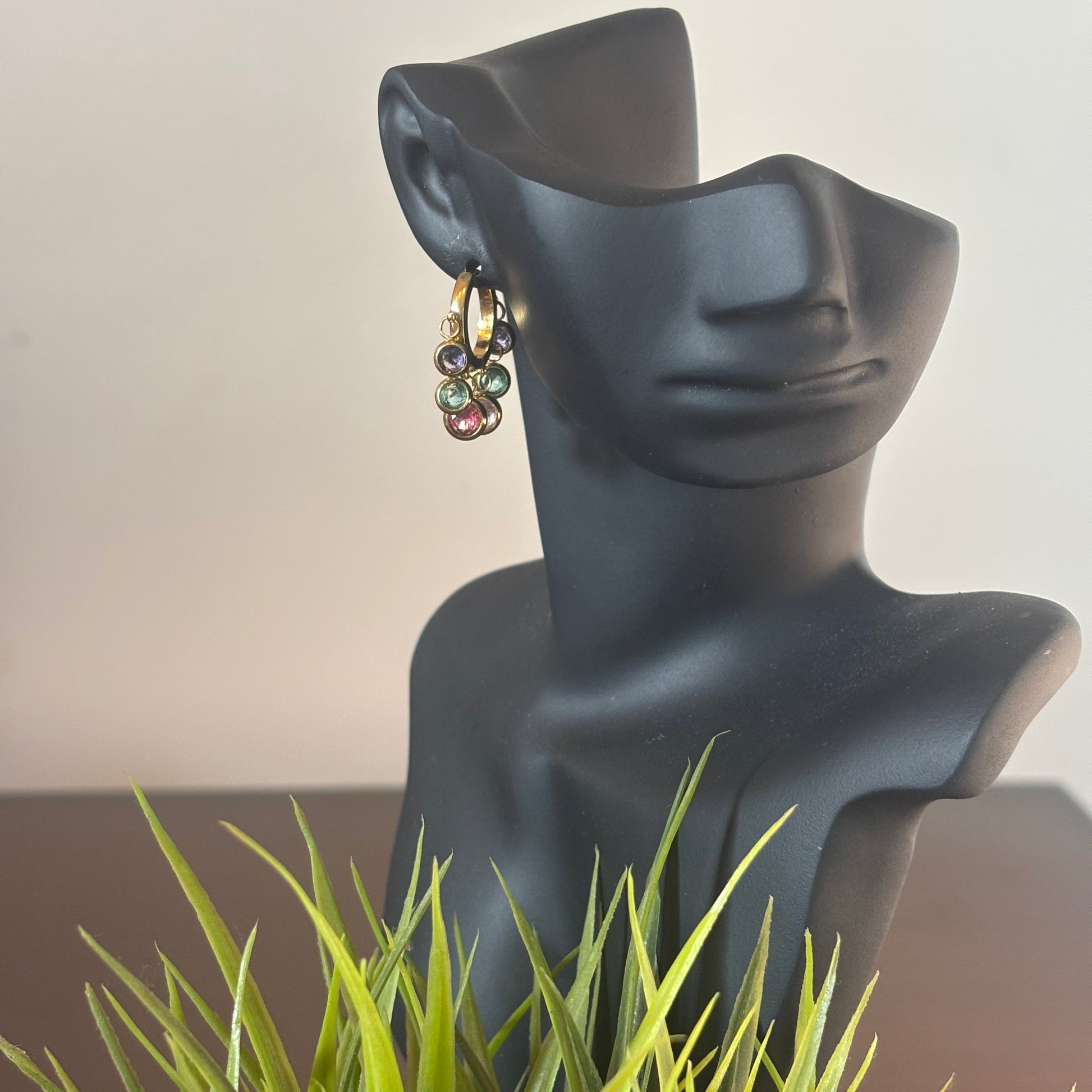 Gold hoop earring with dangling multicolor bead charms