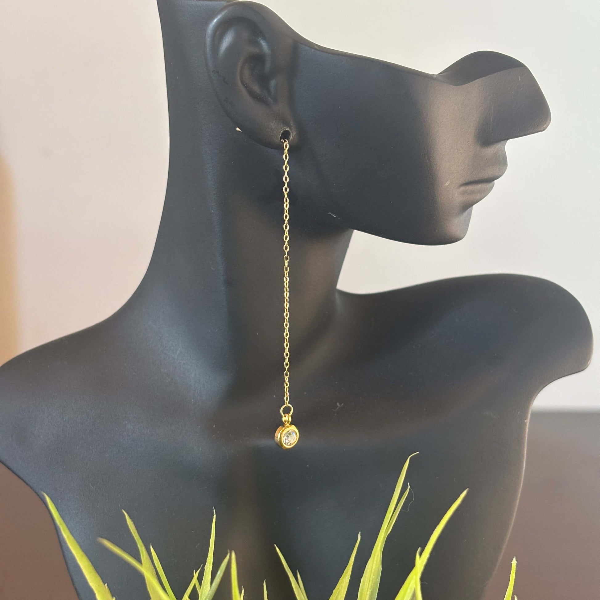 Gold threader drop earrings on mannequin, long chain with round crystal charm