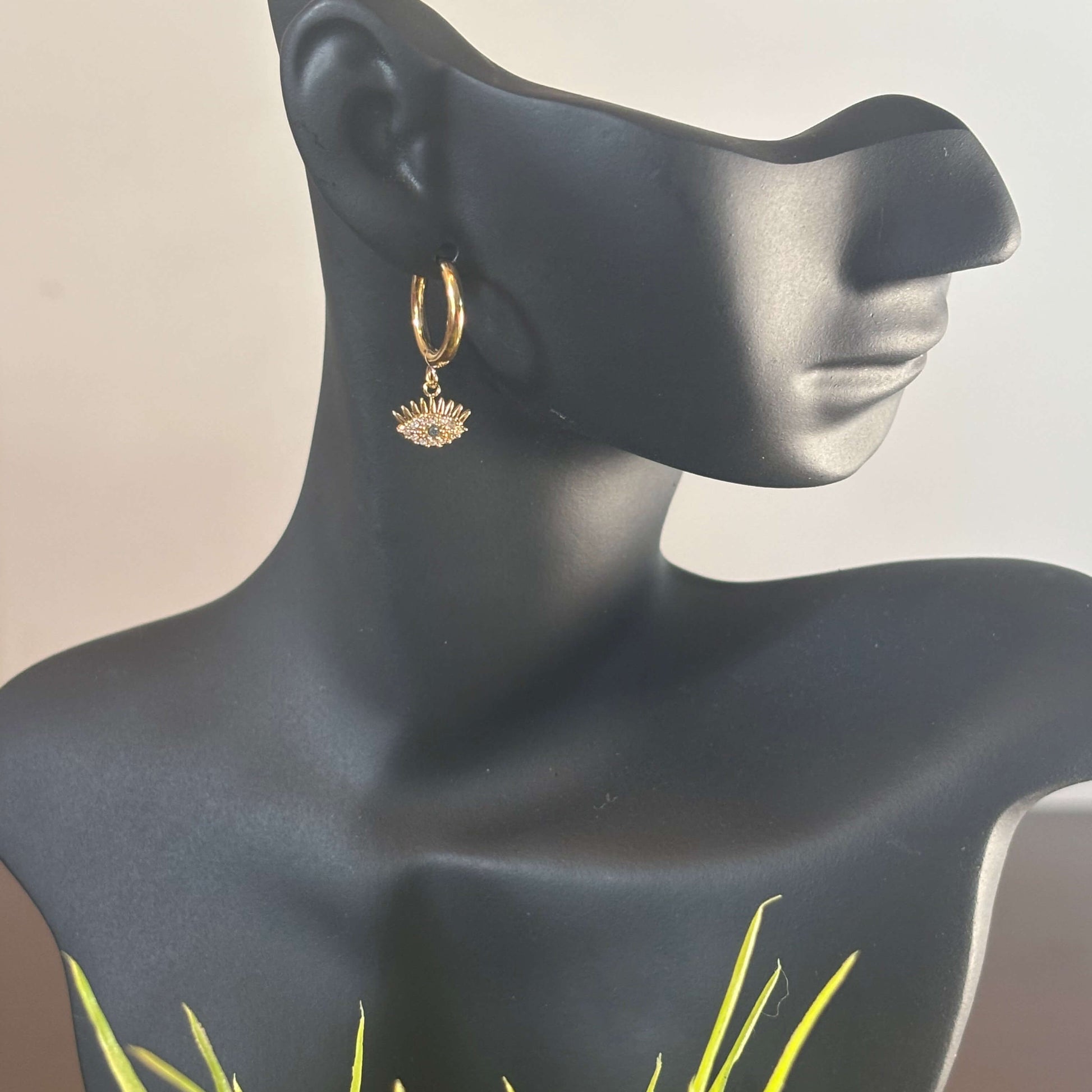Gold huggie hoop earring with evil eye charm dangle, dangling round fan-shaped charm