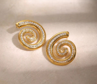 Gold spiral stud earrings with crystal pave swirl accents