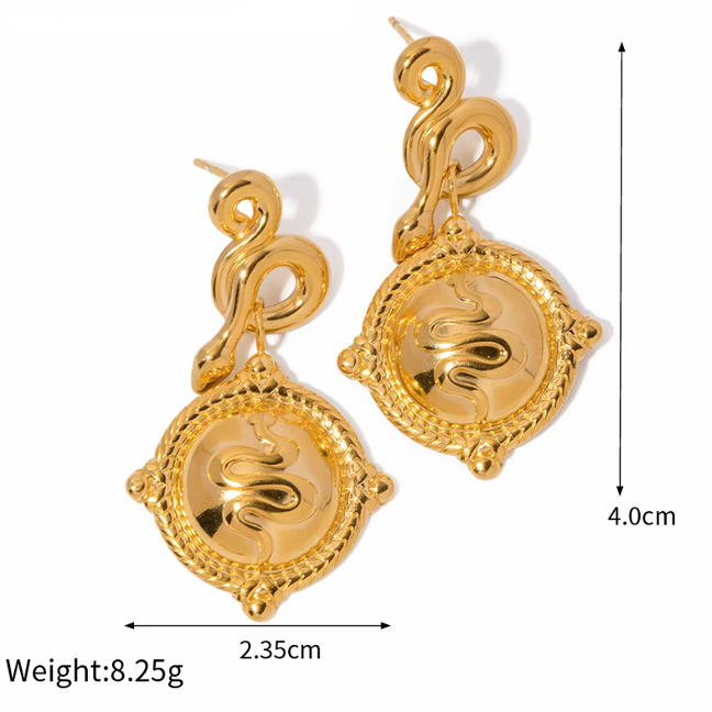 Gold-tone square drop earrings with ornate filigree border and engraved swirl face
