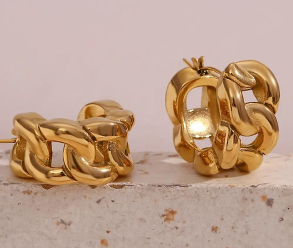 Pair of gold chunky hoop earrings with sculpted interlocking rings