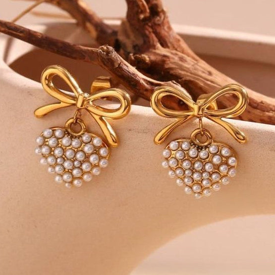 Gold-tone pearl heart earrings with bow dangles
